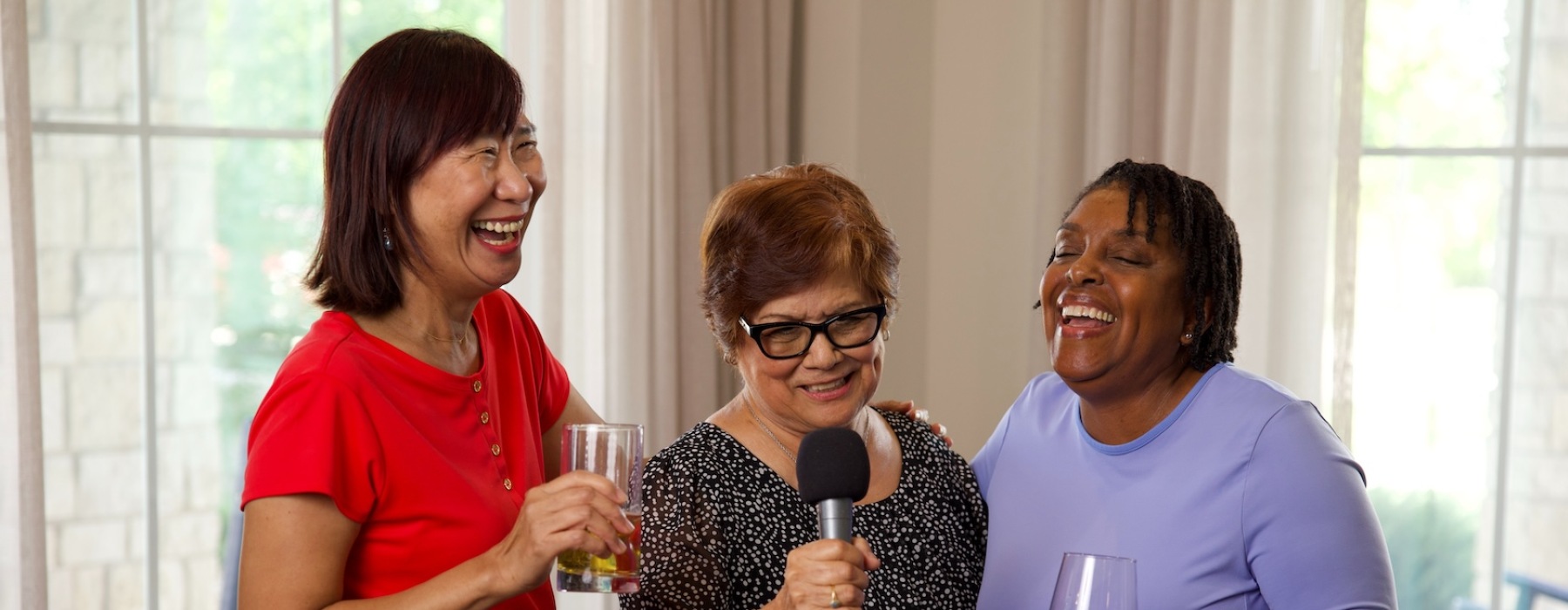 three woman in a bright room