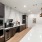 a clubhouse kitchen with appliances and seating