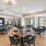 a clubhouse lounge with seating and a fish tank