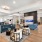 a clubhouse lounge with seating and fish tank