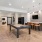 a clubhouse lounge with billiards table and tv