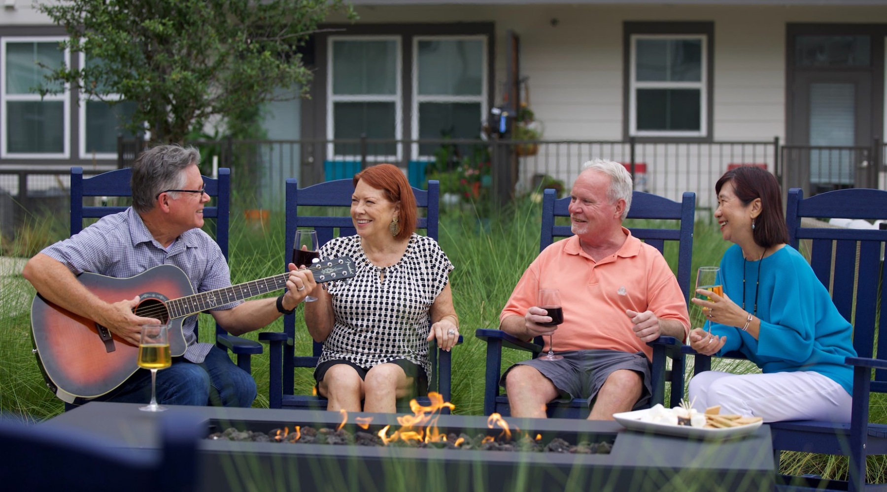 A Truly Active Living Experience three people listening to guitar player