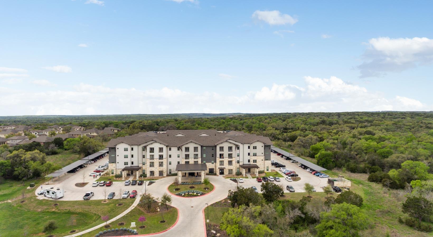Find your perfect fit at ArborView a large building with a parking lot