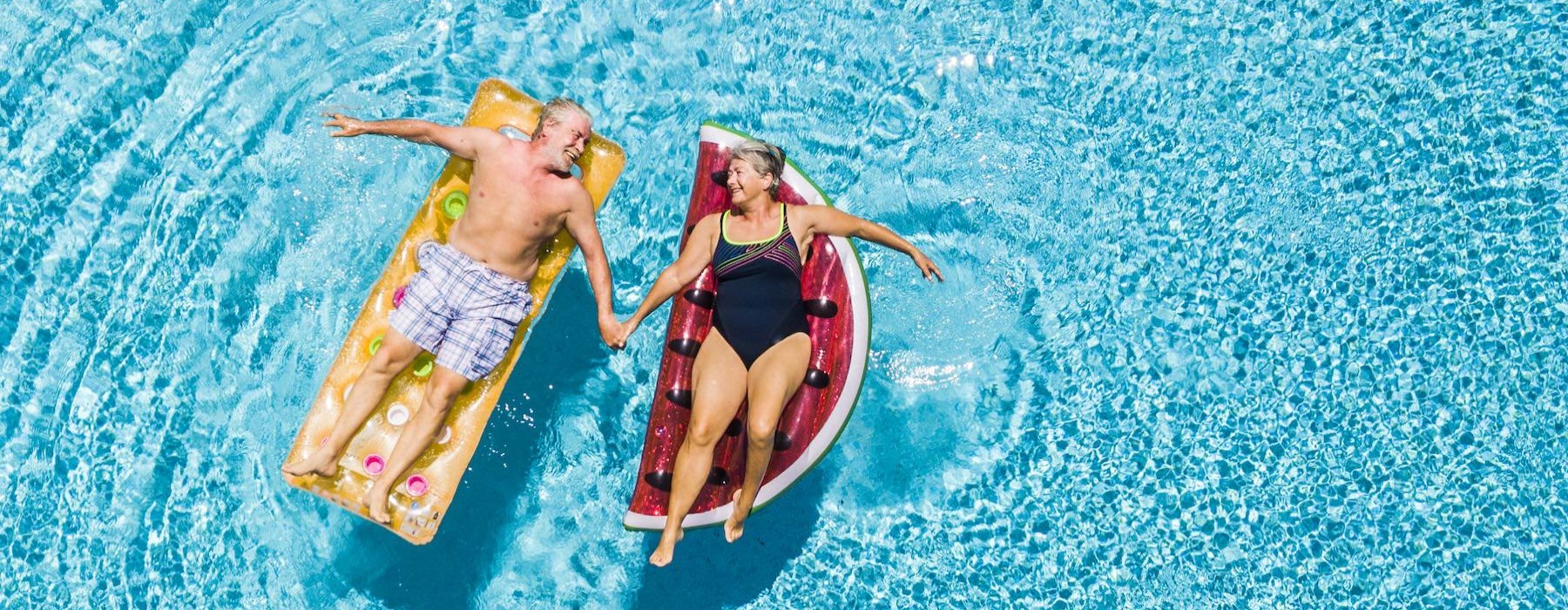 a couple of people in swimsuits in the water