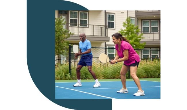 a couple of people play pickleball