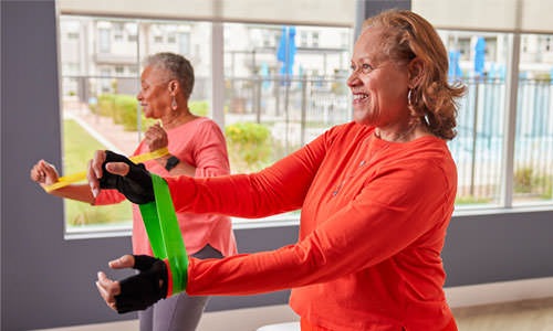 women exercising with bands